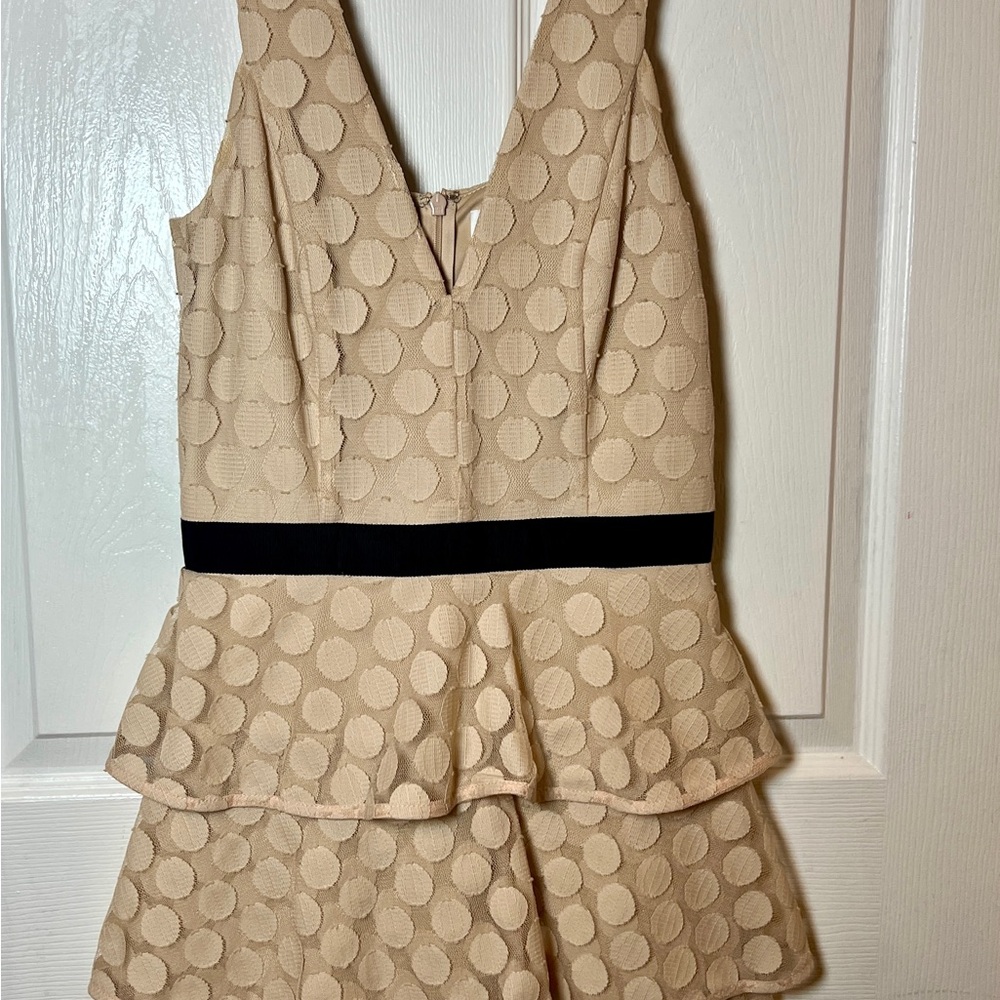 Chic Beige Peplum Dress with Black Detail